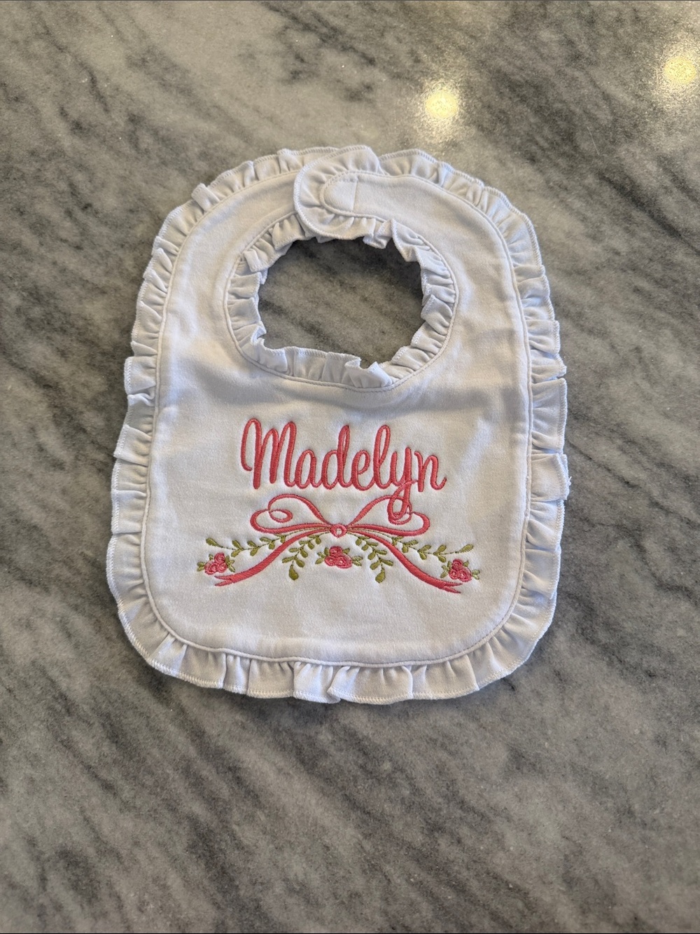 MADELYN White Ruffle Bib with Pink Embroidery